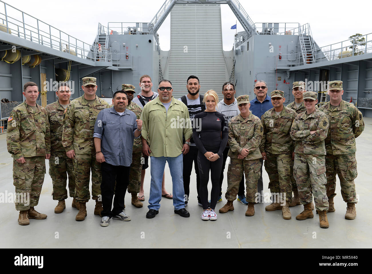 UFC Fighters and guests pose for a group photo with U.S. Army Soldiers assigned to the 335th Transportation Detachment at Joint Base Langley-Eustis, Va., April 6, 2017. During the visit, Soldiers explained the unique capabilities of Army watercraft and other deployable assets. (U.S. Air Force photo/Staff Sgt. Teresa J. Cleveland) Stock Photo