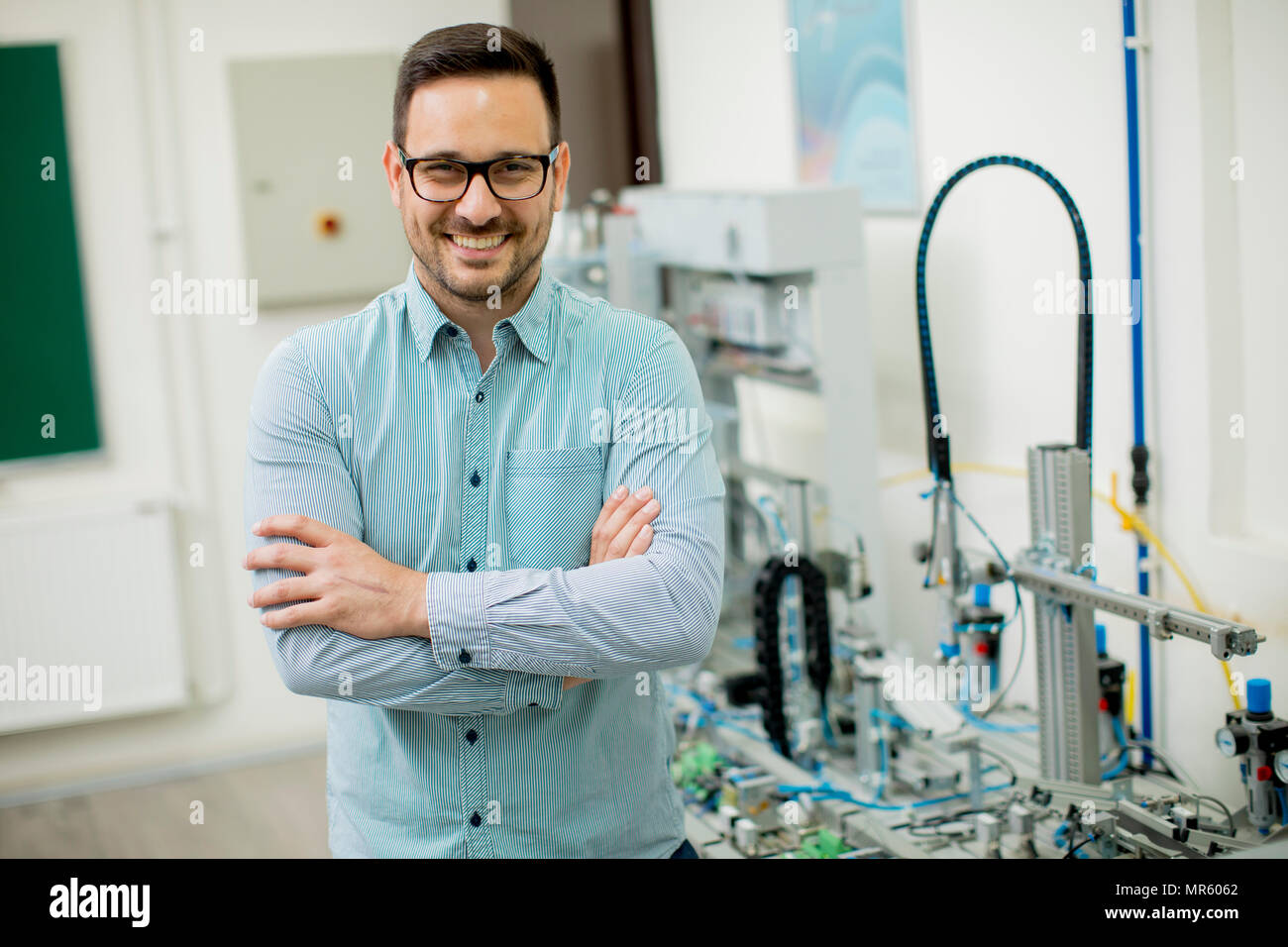 Handsome young man in the electronic workshop Stock Photo