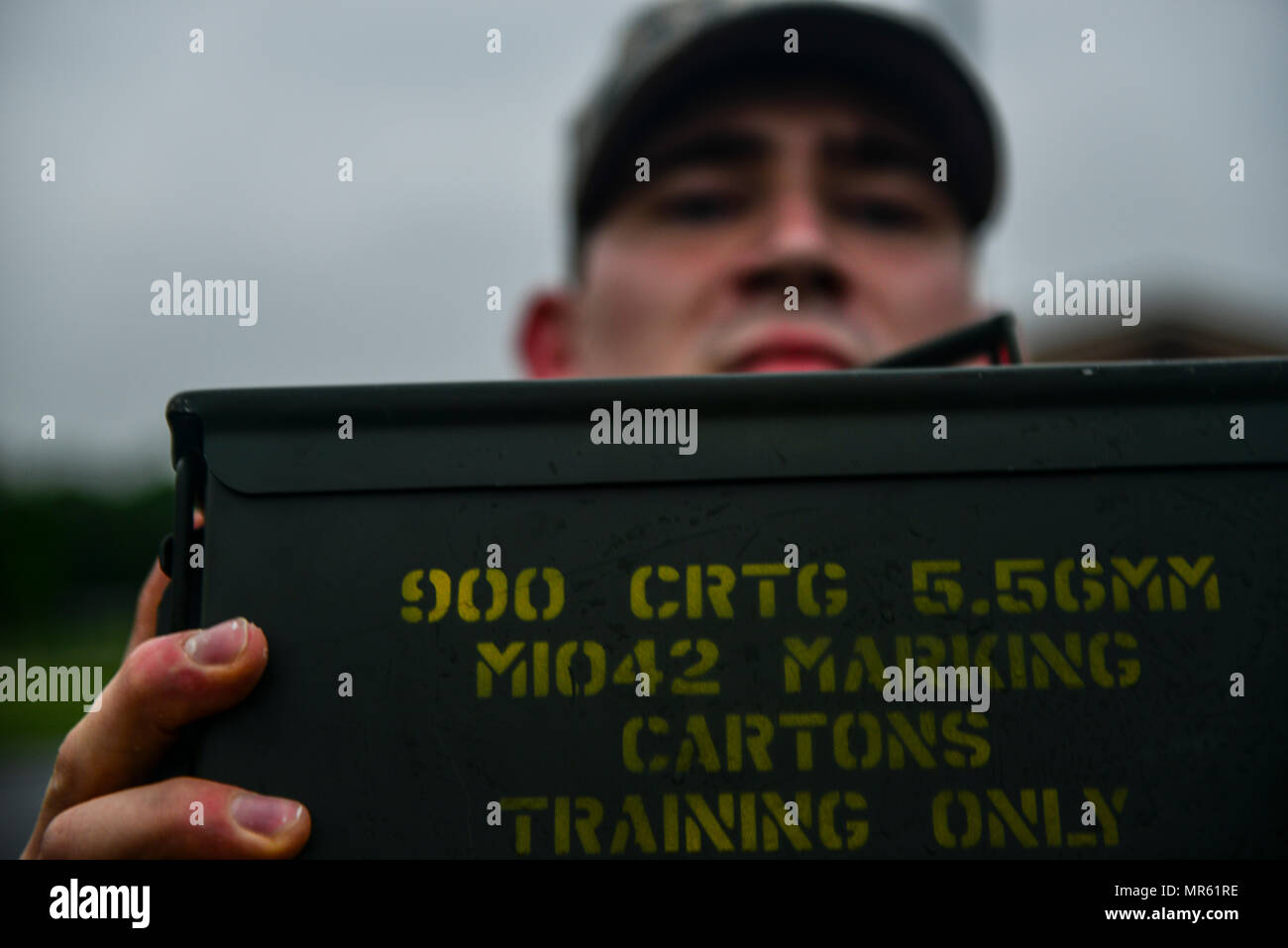 U.S. Air Force Staff Sgt. Jonathan Scott, 633rd Security Forces Squadron bravo flight response force leader, performs ammunition can presses during a training evolution at Joint Base Langley-Eustis, Va., April 28, 2017. Scott is a member of 633rd SFS Emergency Services Team, equivalent to a civilian police SWAT (Special Weapons and tactics) Team. (U.S. Air Force photo/Tech. Sgt. Daylena S. Ricks) Stock Photo