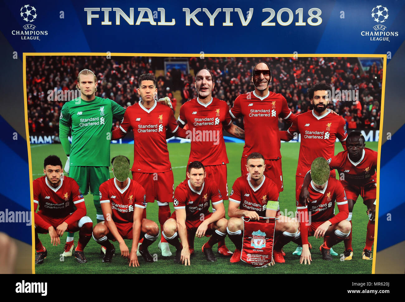 Fans pose with a cardboard cutout of the Liverpool team in Kiev where Liverpool will play Real