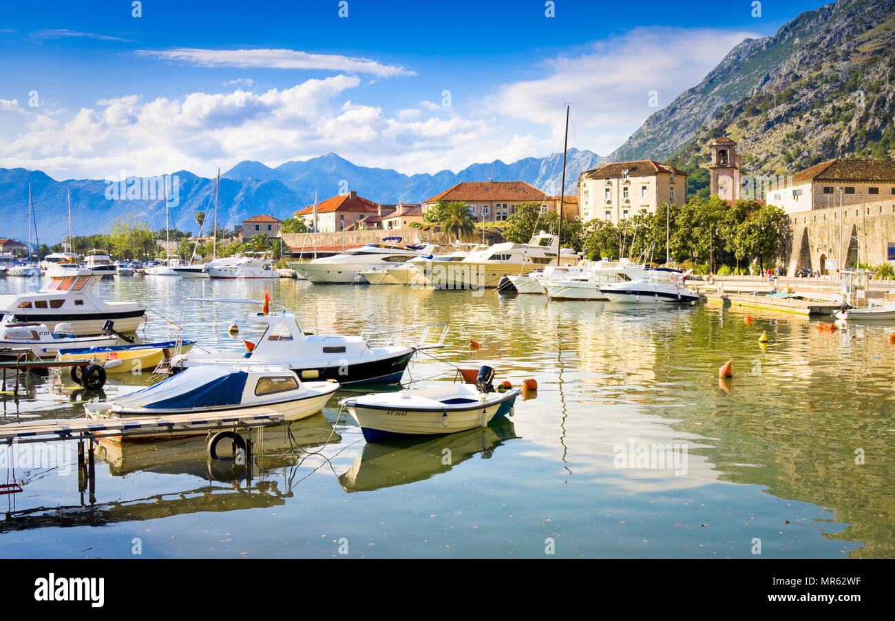 KOTOR, MONTENEGRO - JUNE 24, 2015: The boats in sea at sunset with  mountains and old city Stock Photo - Alamy