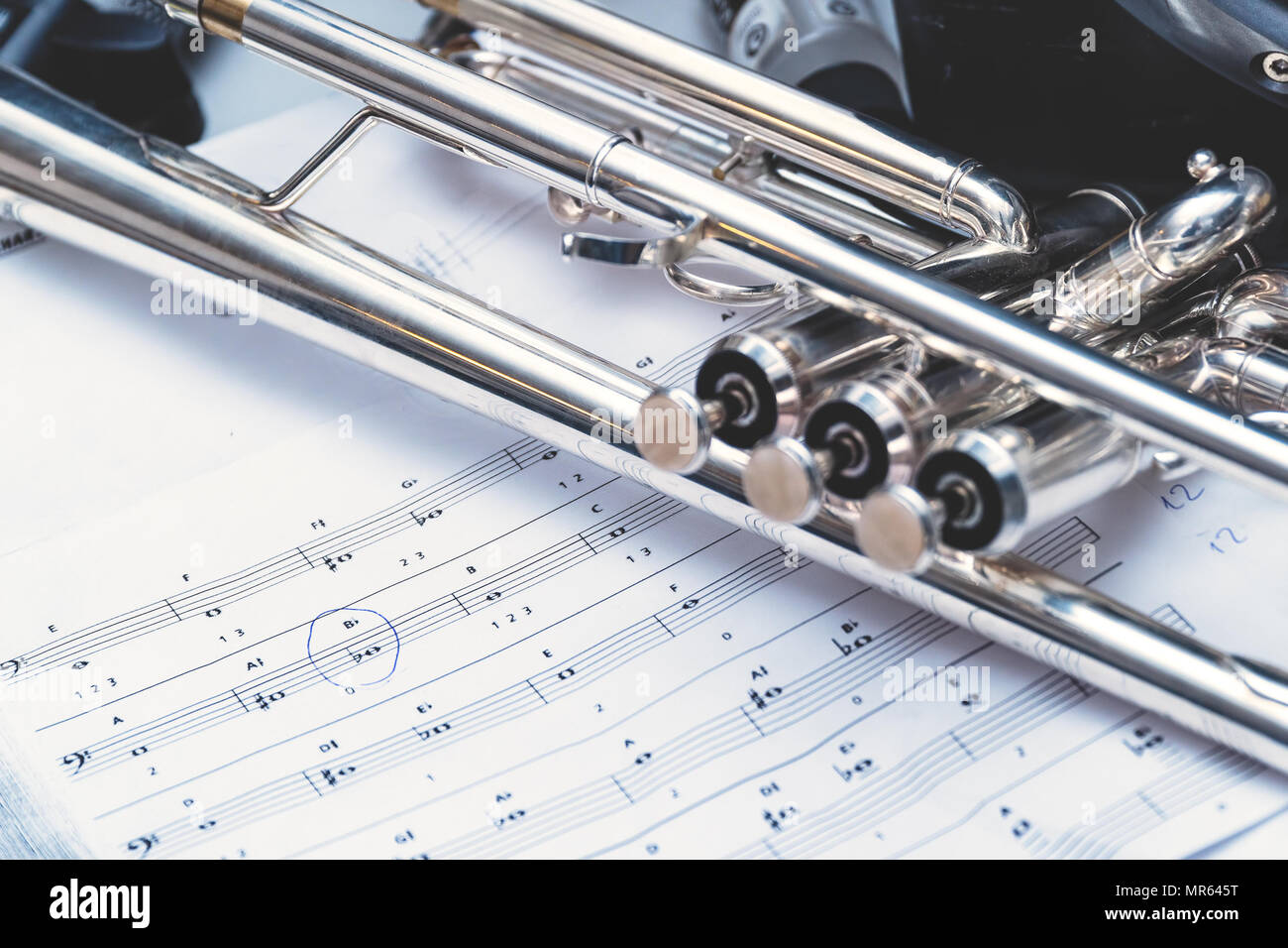 Wind instrument trumpet and notes. Selective focus Stock Photo Alamy