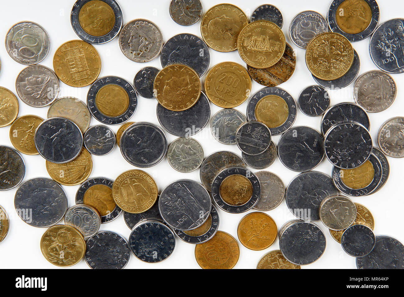 some old italian lire coins on white background Stock Photo Alamy