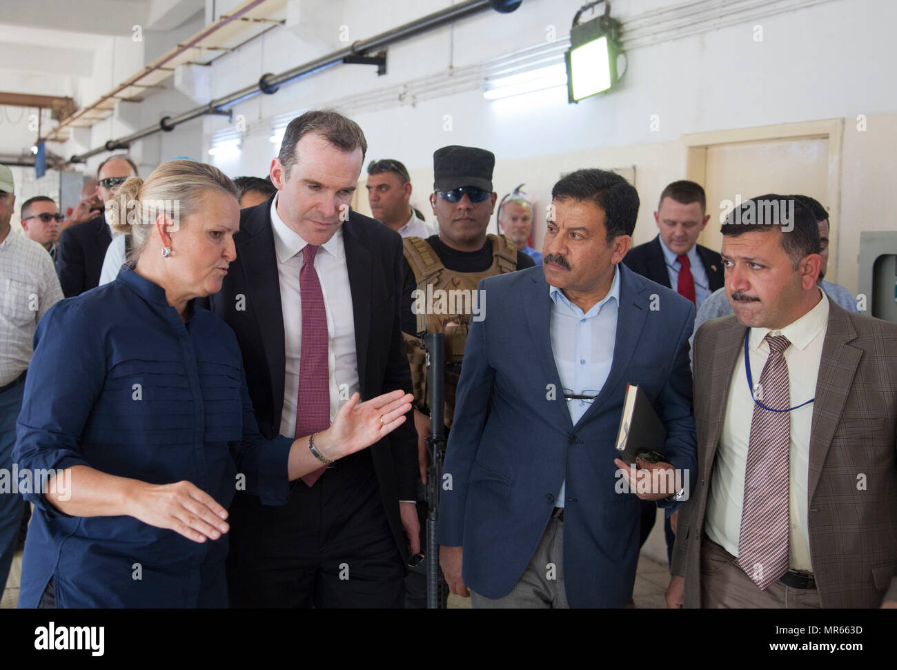 Lise Grande (left), the Deputy Special Representative of the United Nations Assistance Mission for Iraq, and Brett McGurk, the Special Presidential Envoy for the Global Coalition to Counter ISIS, tour the As-Salamiyah Water Treatment Plant with Iraqi officials near southeast Mosul, Iraq, May 15, 2017. Combined Joint Task Force – Operation Inherent Resolve remains committed to assisting the Iraqi security forces in the defeat of ISIS and setting conditions for security in newly liberated areas. CJTF-OIR is the global Coalition to defeat ISIS in Iraq and Syria. (U.S. Army photo by Cpl. Rachel Di Stock Photo