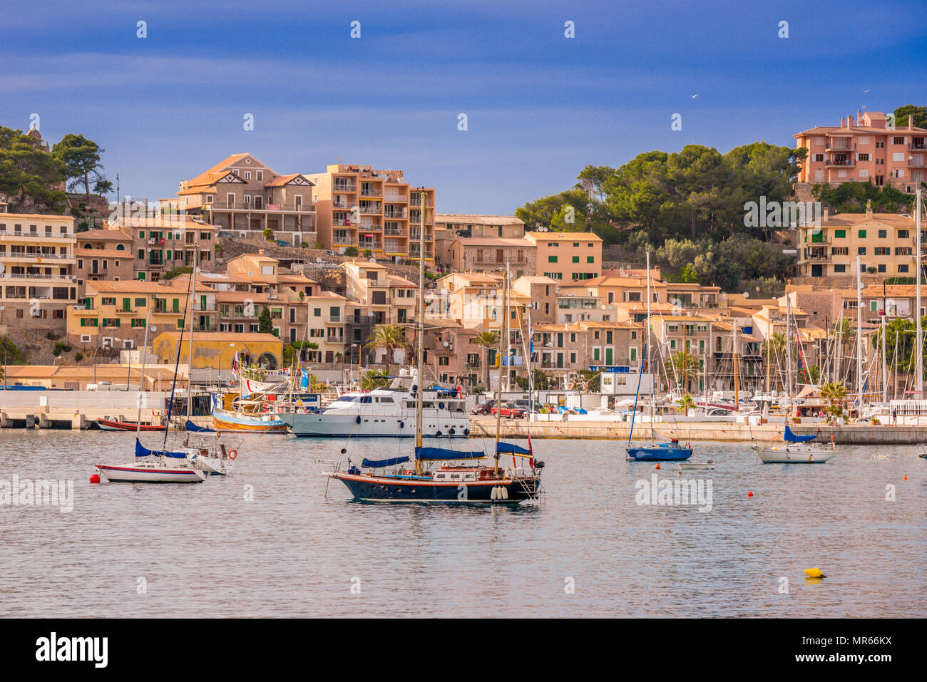 Puerto de Soller, Port of Mallorca island in balearic islands, Spain. Beautiful  beach and bay with boats in clear blue water of summer day. Stock Photo