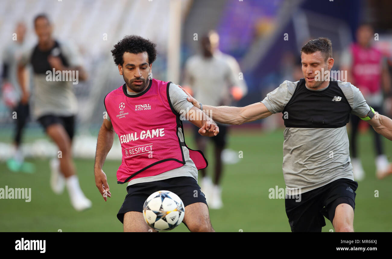 Liverpool's Mohamed Salah (left) and James Milner battle for the ball during the training session at the NSK Olimpiyskiy Stadium, Kiev. Stock Photo