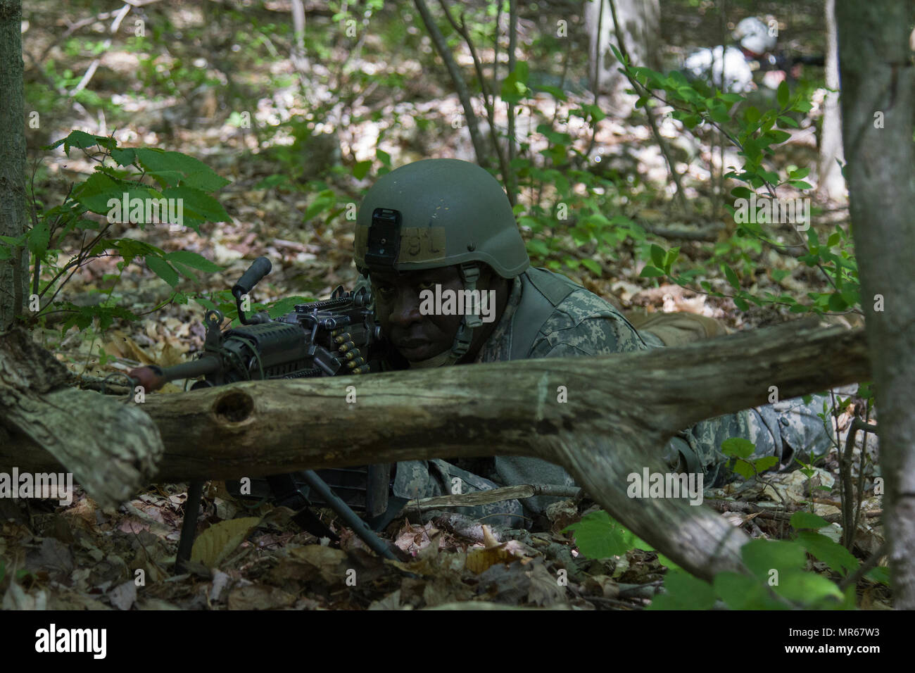 U.S. Army Officer Candidate Isaac Abotsi, assigned to the Hotel Company, 2nd Modular Training Battalion, 124th Regiment (Regional Training Institute), Vermont National Guard, provides security during a bunker clearing lane at New Hampshire National Guard Training Site in Center Strafford, Nh., May 19, 2017. Soldiers from Connecticut, Maine, Massachusetts, New Hampshire, New Jersey, New York, Rhode Island, and Vermont participated in the Officer Candidate School Field Leadership Exercise in preparation for graduation and commission. (U.S. Army National Guard photo by Spc. Avery Cunningham) Stock Photo