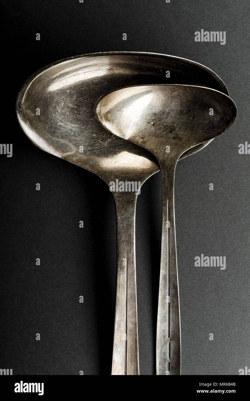 Vintage metallic ladle and scoop on gray background Stock Photo - Alamy