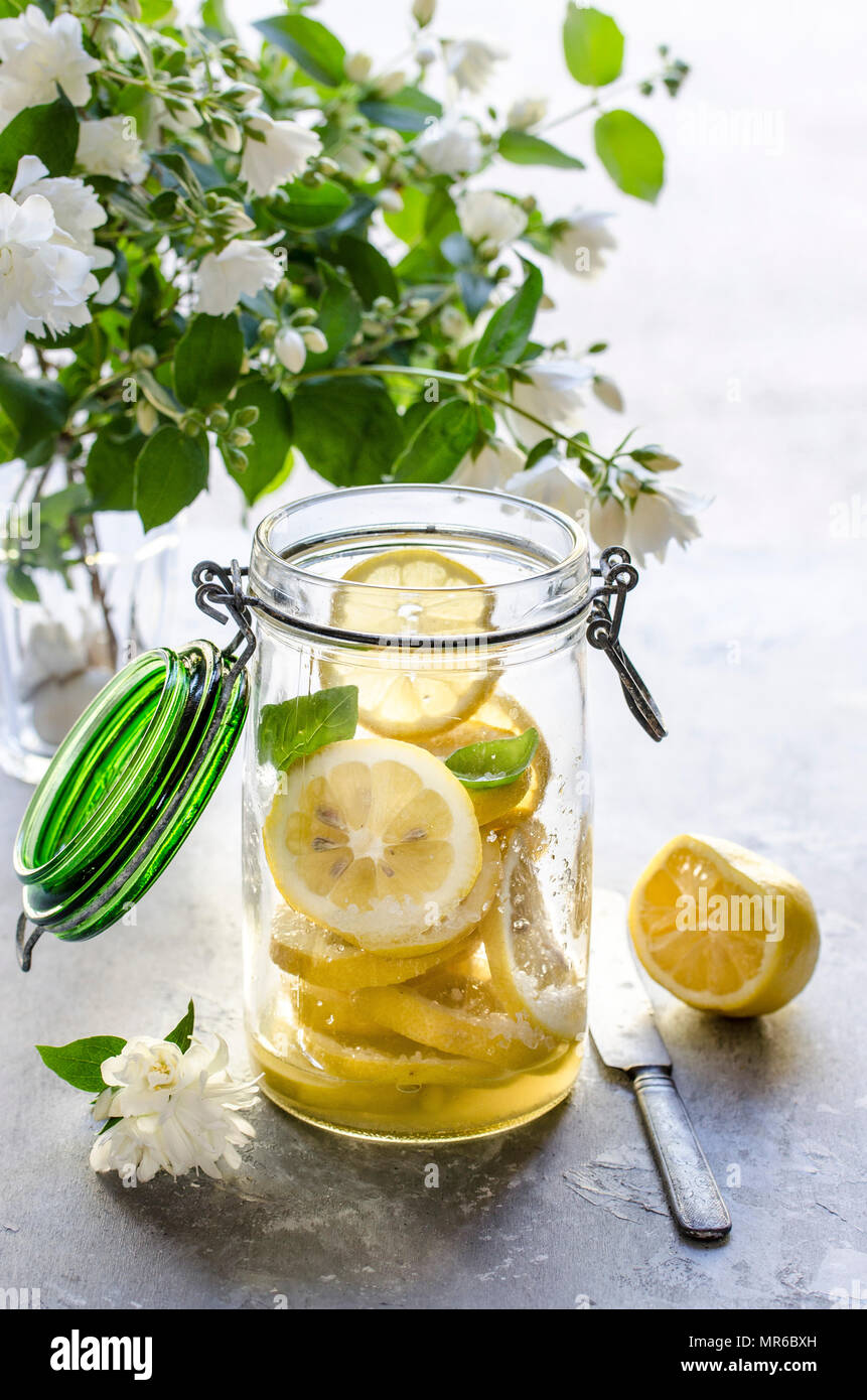 Making preserved lemon. Sliced fresh lemons in a jar Stock Photo Alamy