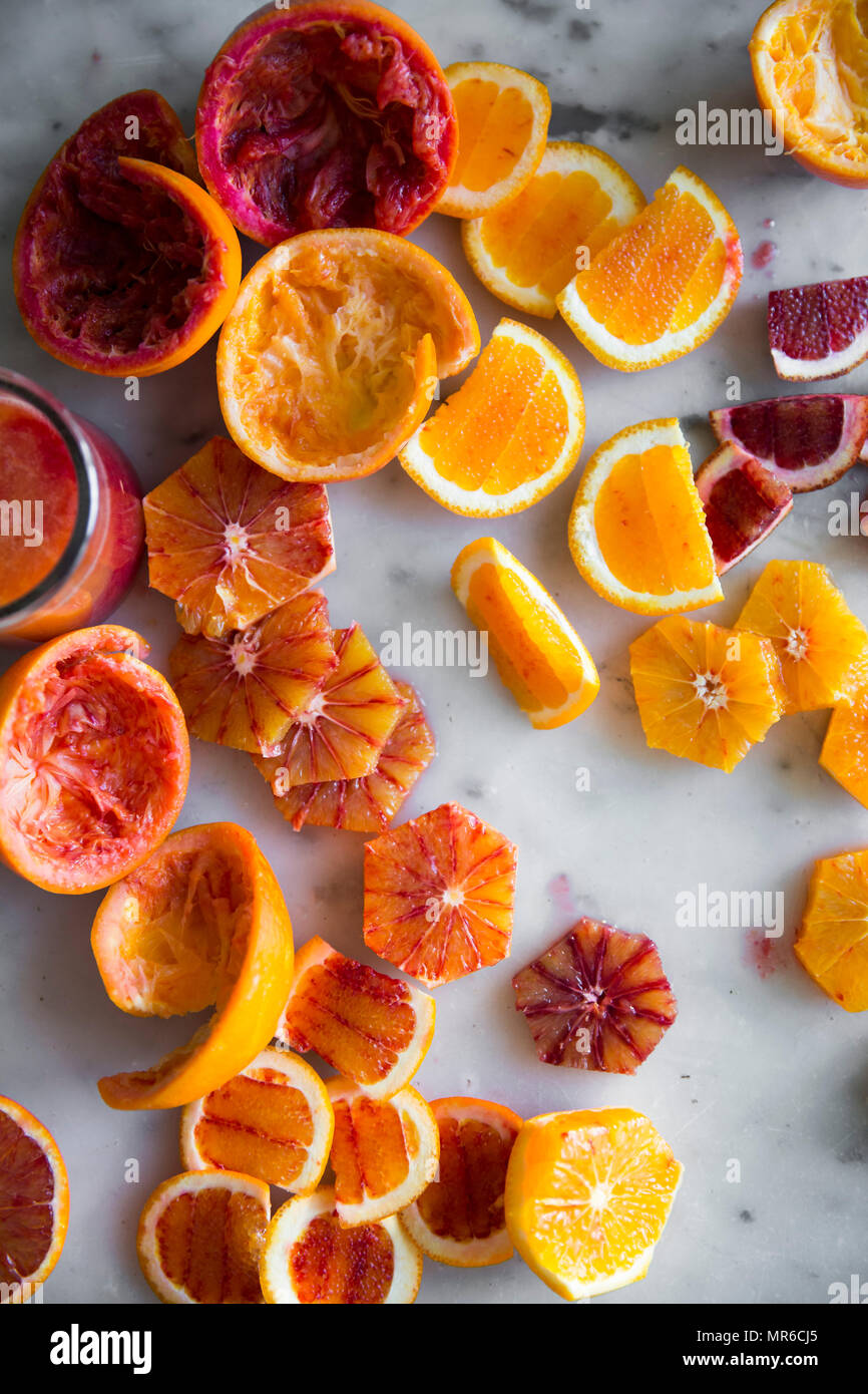 Peeled blood oranges for a fruit juice drink Stock Photo Alamy