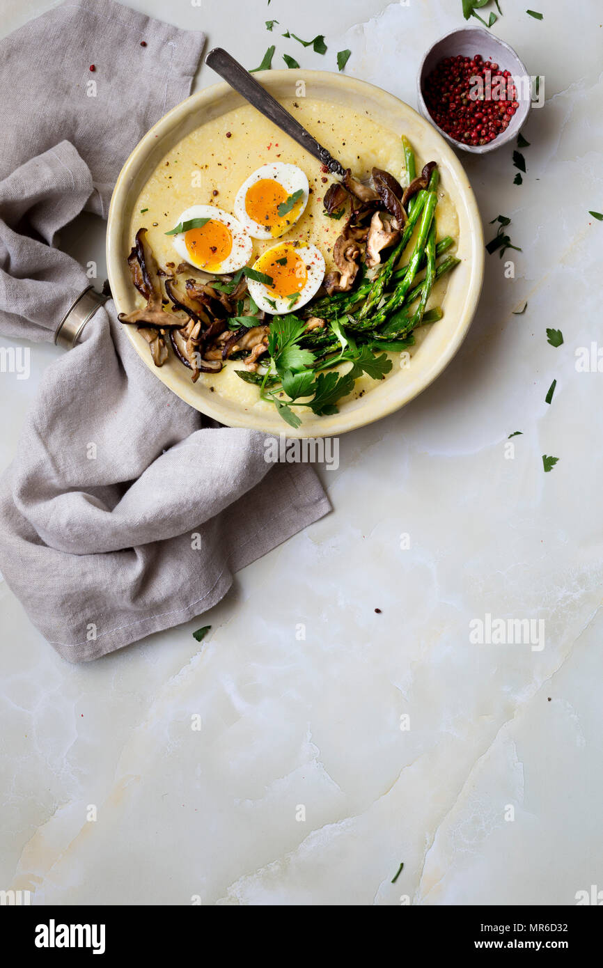 Breakfast of polenta, eggs and mushrooms Stock Photo Alamy
