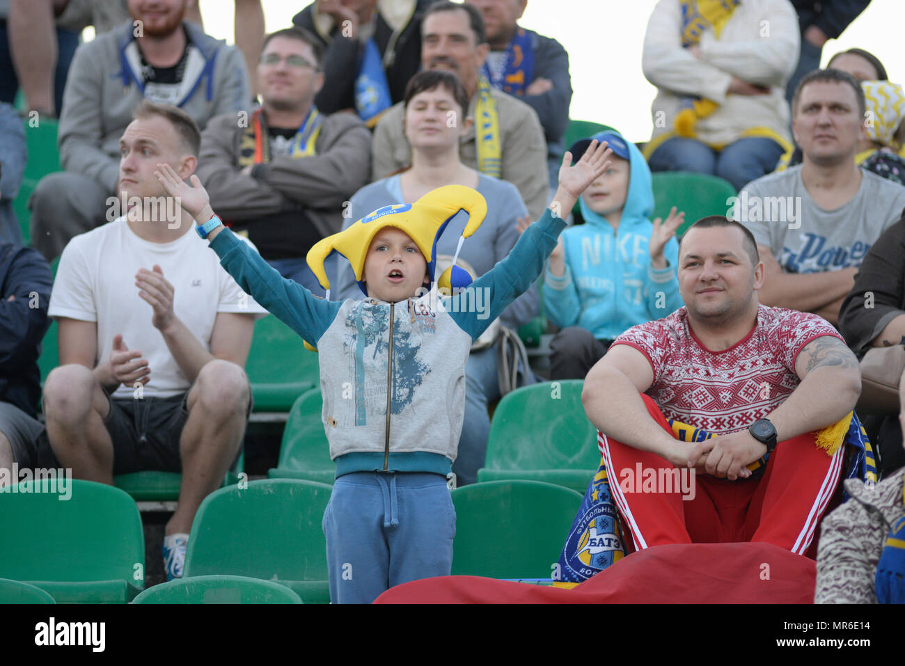 MINSK, BELARUS - MAY 23, 2018: Little fan having fun during the Belarusian Premier League football match between FC Dynamo Minsk and FC Bate at the Tractor stadium. Stock Photo
