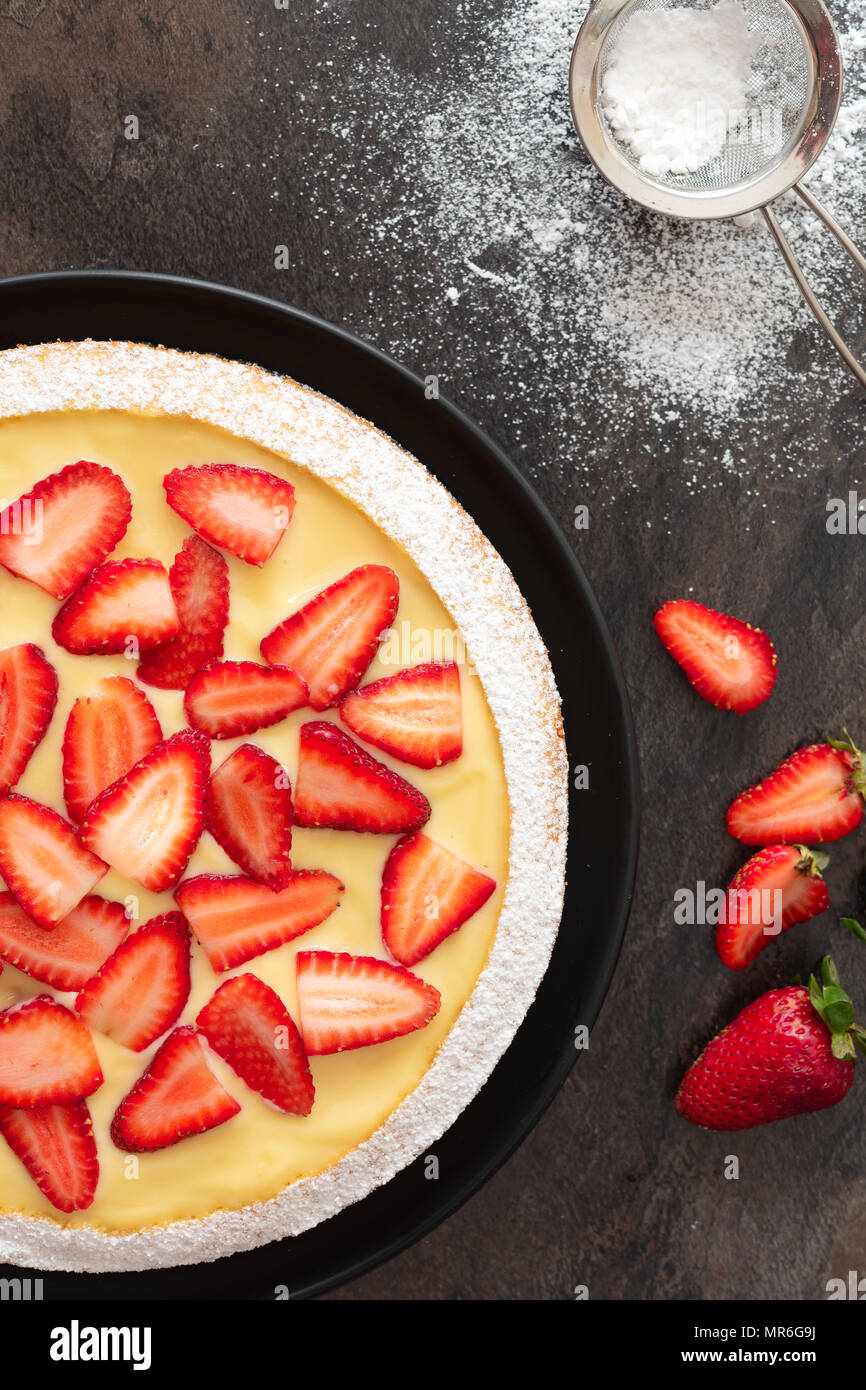Strawberry Custard Dessert Cake with powdered sugar and ripe ...