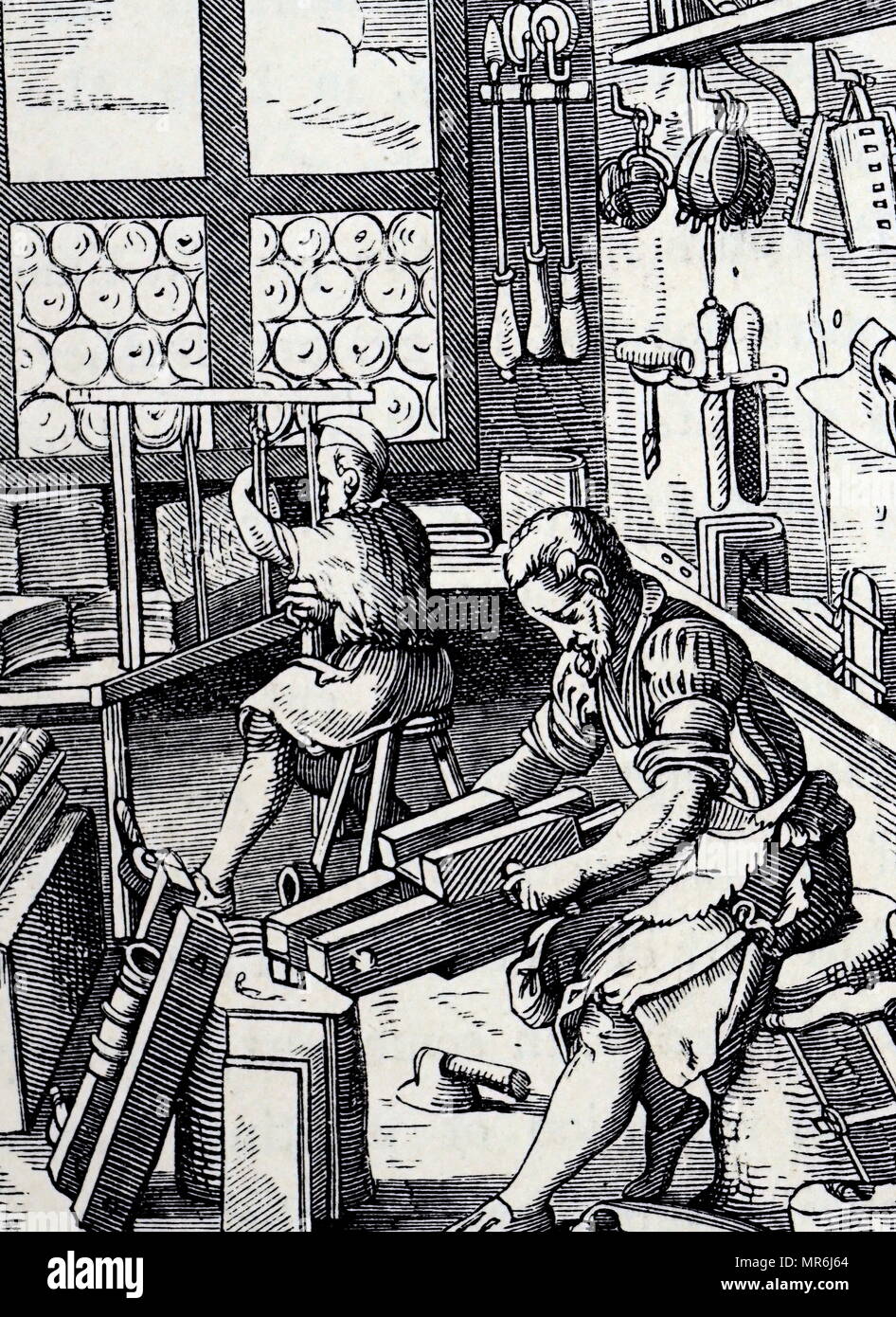 Woodcut engraving depicting a bookbinder's workshop by Jost Amman. Jost Amman (1539-1591) a Swiss-German artist. Dated 16th century
