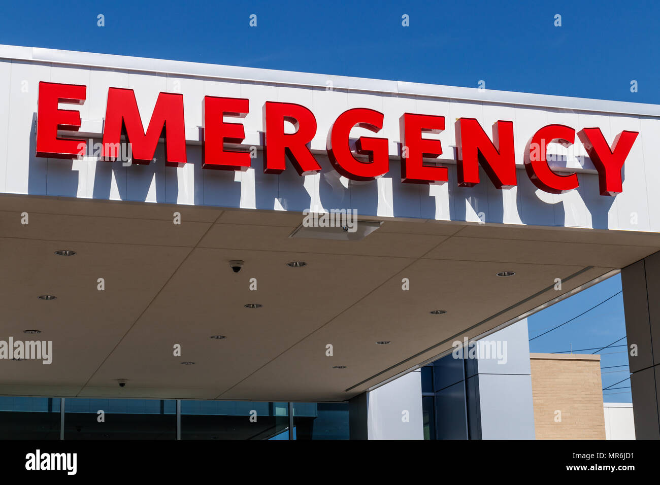 Red Emergency Entrance Sign for a Local Hospital I Stock Photo