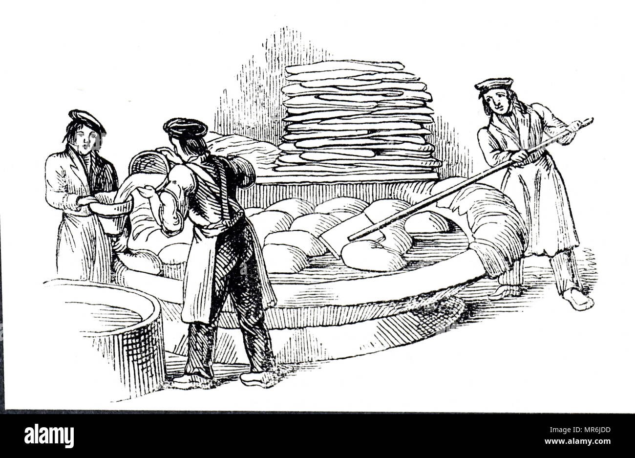 Woodblock engraving depicting the process of tanning goat skins in a sumach solution. To ensure that the whole surface of the skin was exposed to the tanning solution, the skins were blown up and floated in the tub. Dated 19th century Stock Photo
