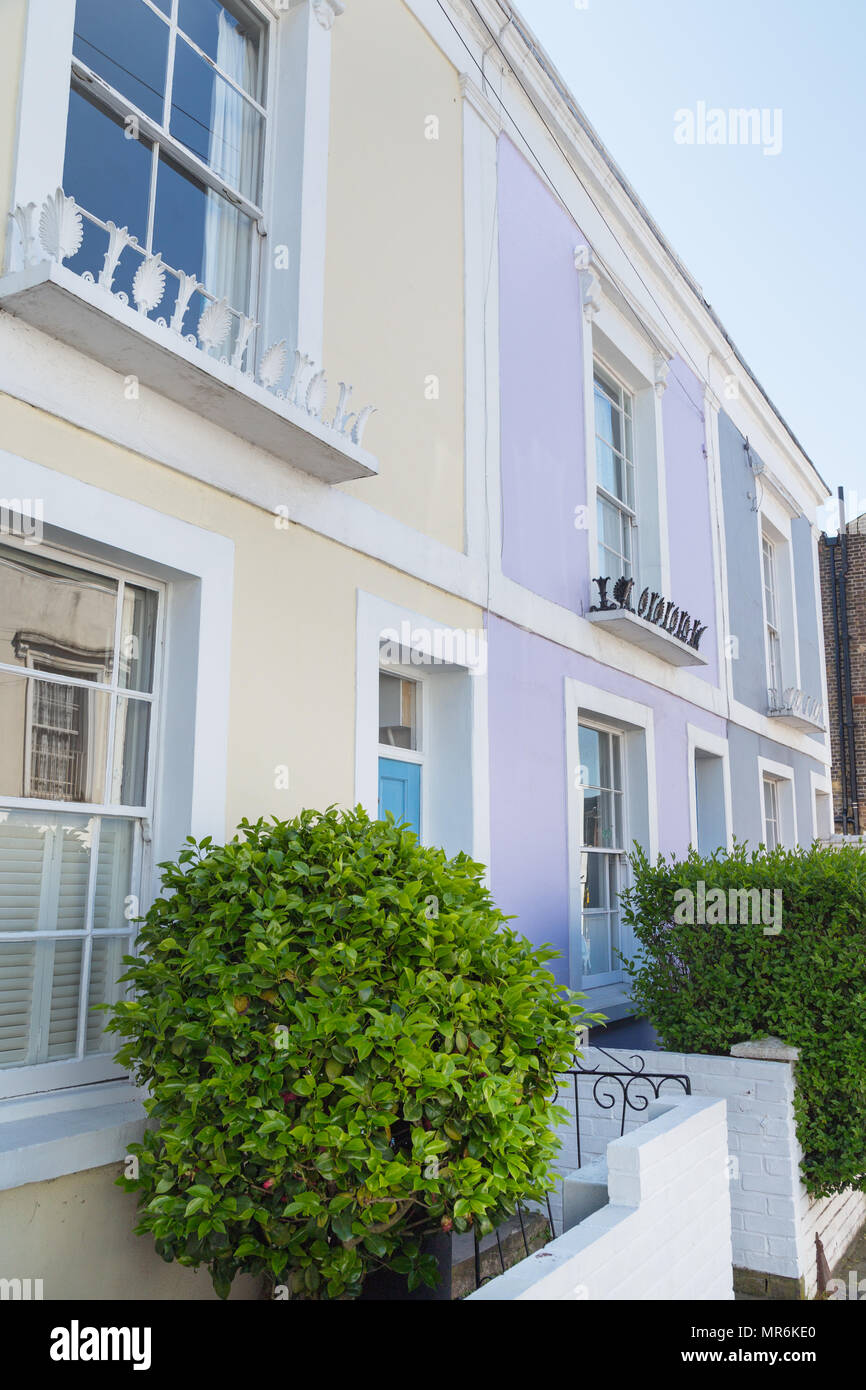 Colourfully painted terraced houses on Leverton Street, Kentish Town, London NW5, England, UK
