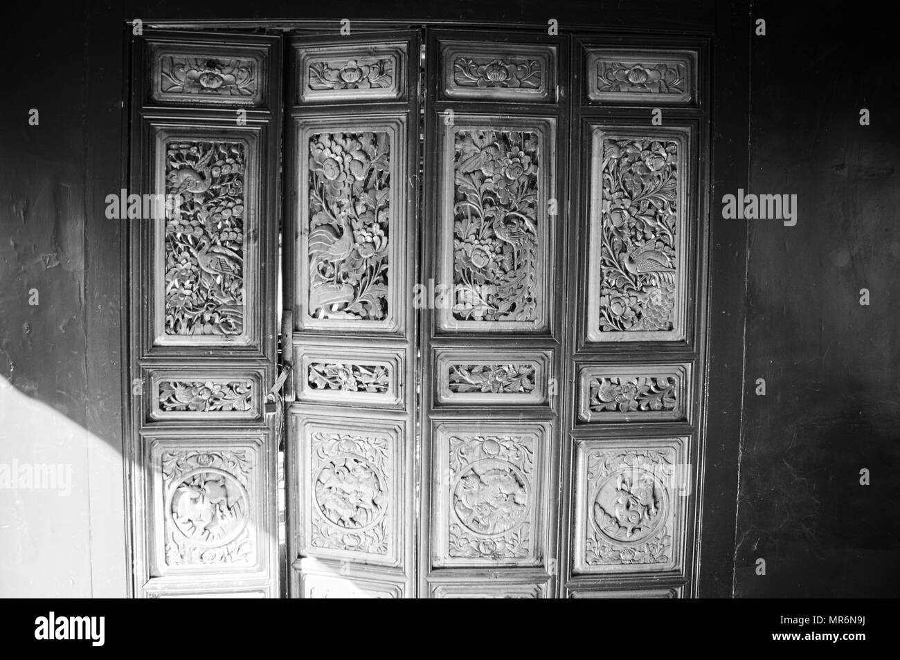 Chinese decorations on the wooden door (Old Town of Lijiang, Yunnan, China) Stock Photo