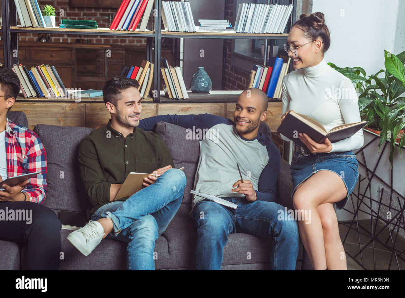 happy young multiethnic students studying together in library Stock ...