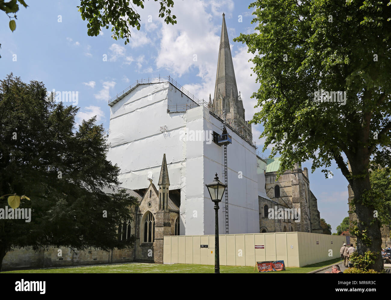 Scaffolding surrounds the chancel at Chichester Cathedral, West Sussex. The structure provides access and weather protection for major roof repairs. Stock Photo