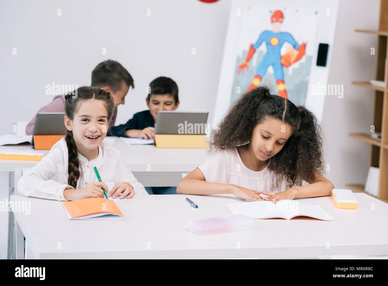 Children using tablets at school hires stock photography and images
