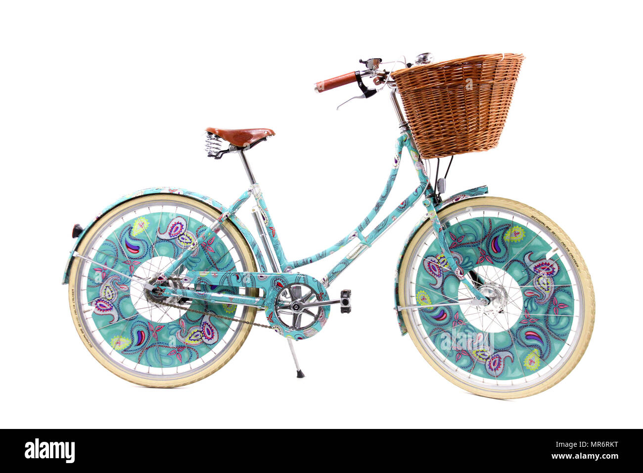 Ladies paisley decorated bicycle isolated on a white studio background. Stock Photo
