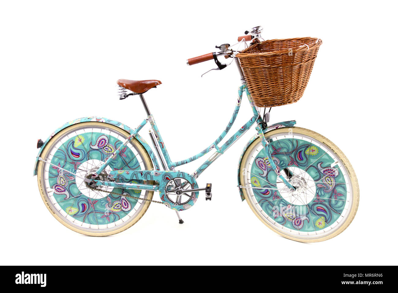 Ladies paisley decorated bicycle isolated on a white studio background. Stock Photo