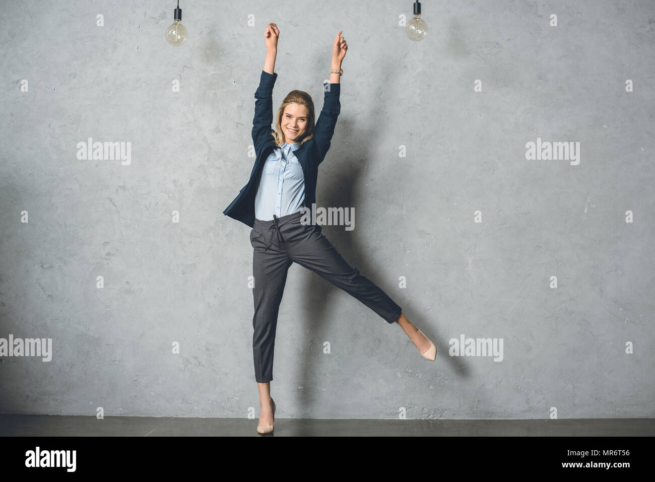 Woman arms outstretched suit hi-res stock photography and images - Alamy