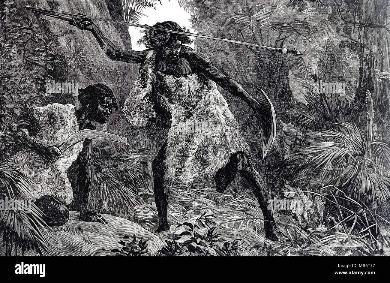 Engraving depicting Australian aborigines hunting with a spear and boomerang. Dated 19th century Stock Photo