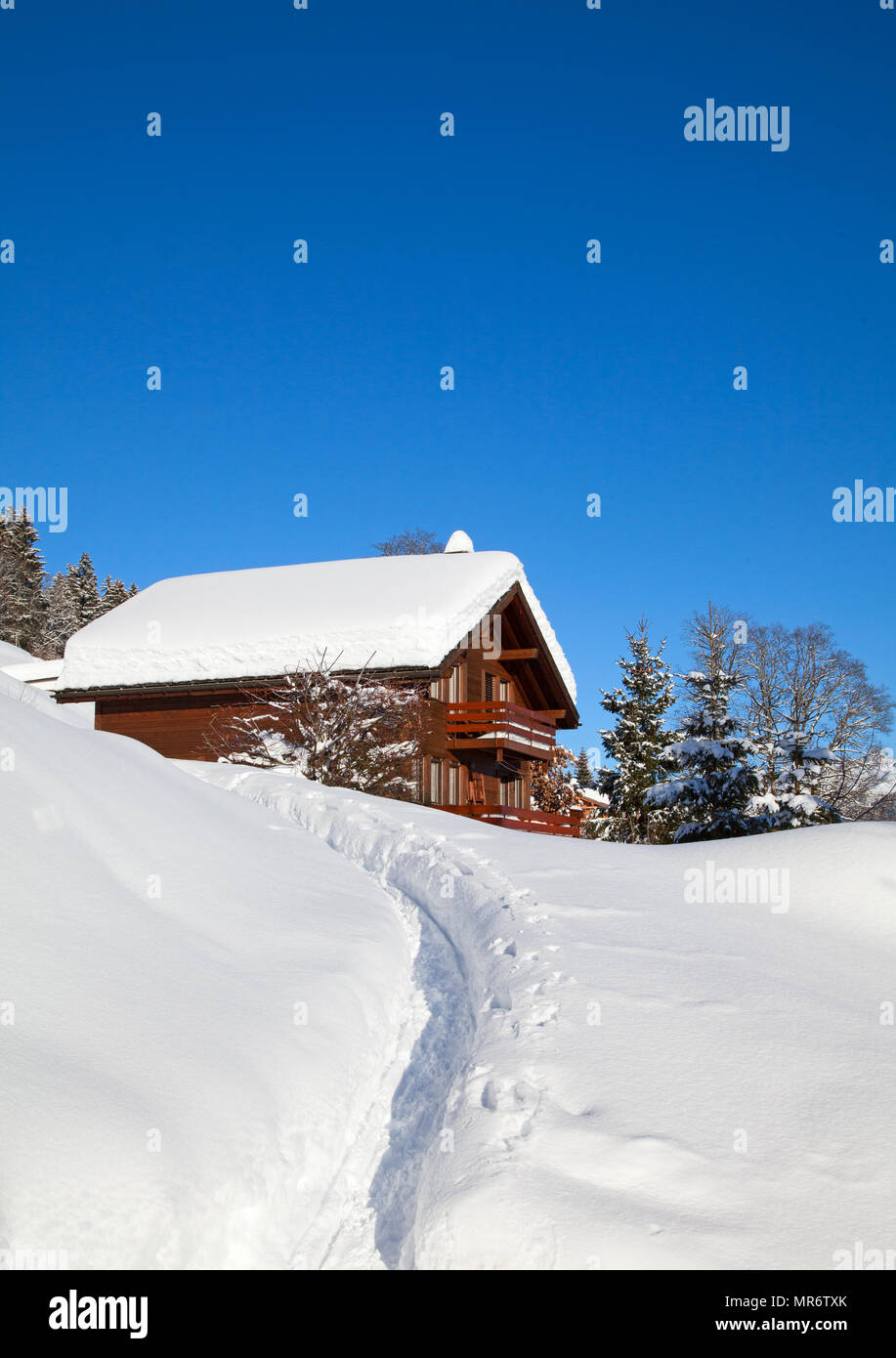 Winter holiday house in swiss alps Stock Photo - Alamy