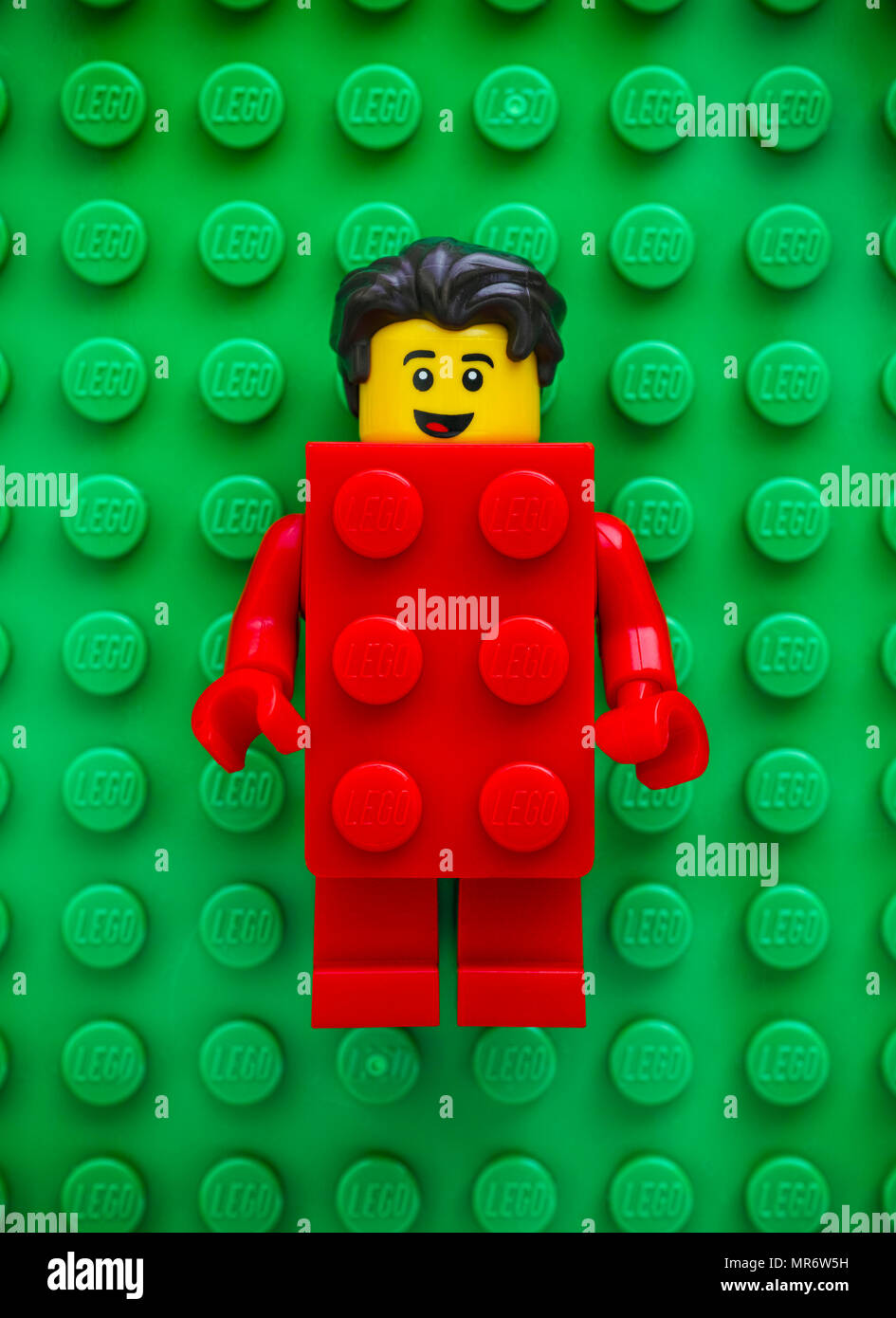 Tambov, Russian Federation - May 20, 2018 Lego Red Suit Brick Guy  minifigure on green baseplate background. Studio shot Stock Photo - Alamy