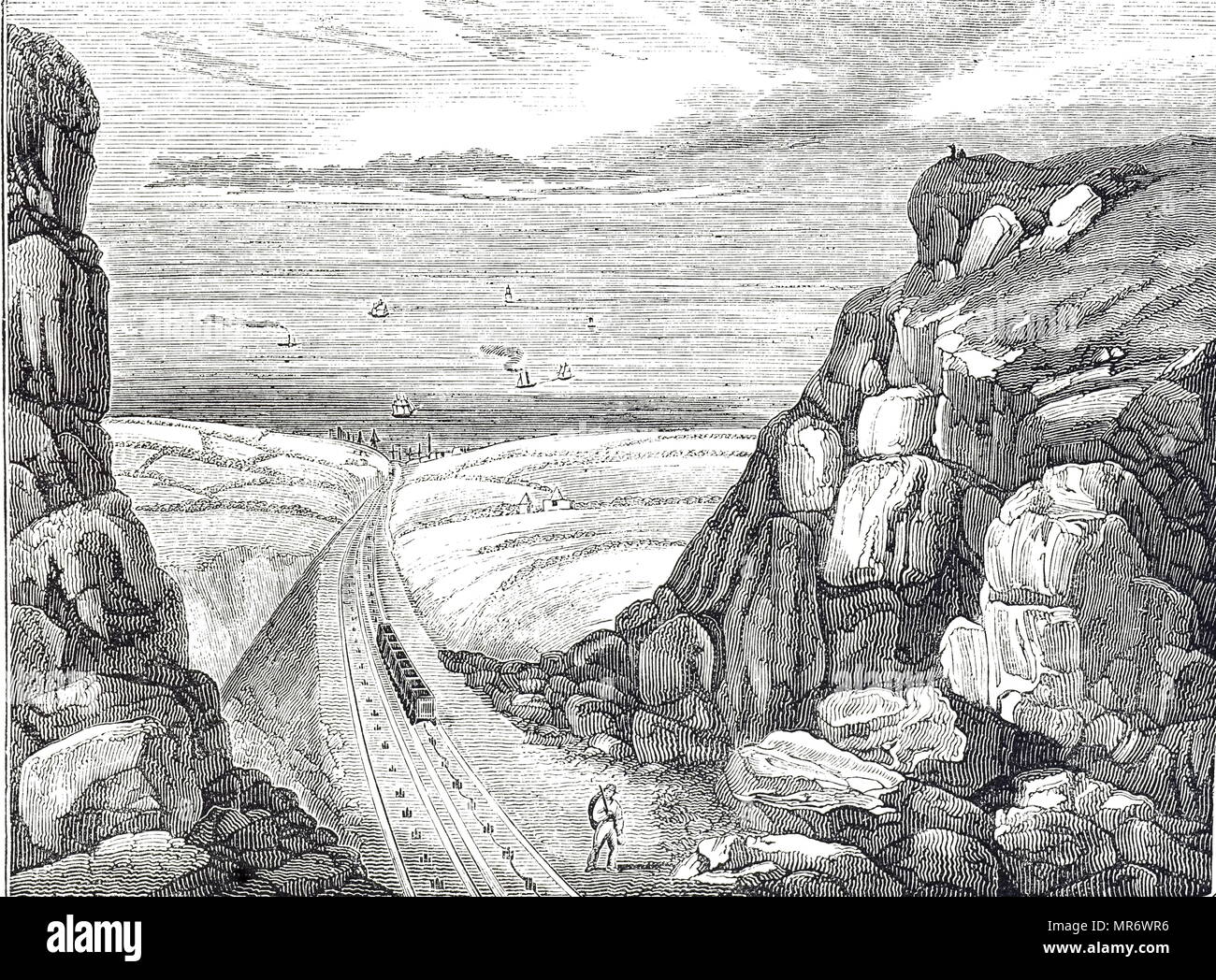 Engraving depicting a view over Seaham Harbour, Durham, showing the end of the inclined plane railway which carried coals to the waiting boats. The weight of the full wagons was sufficient to draw the empty wagons back to the colliery. Dated 19th century Stock Photo