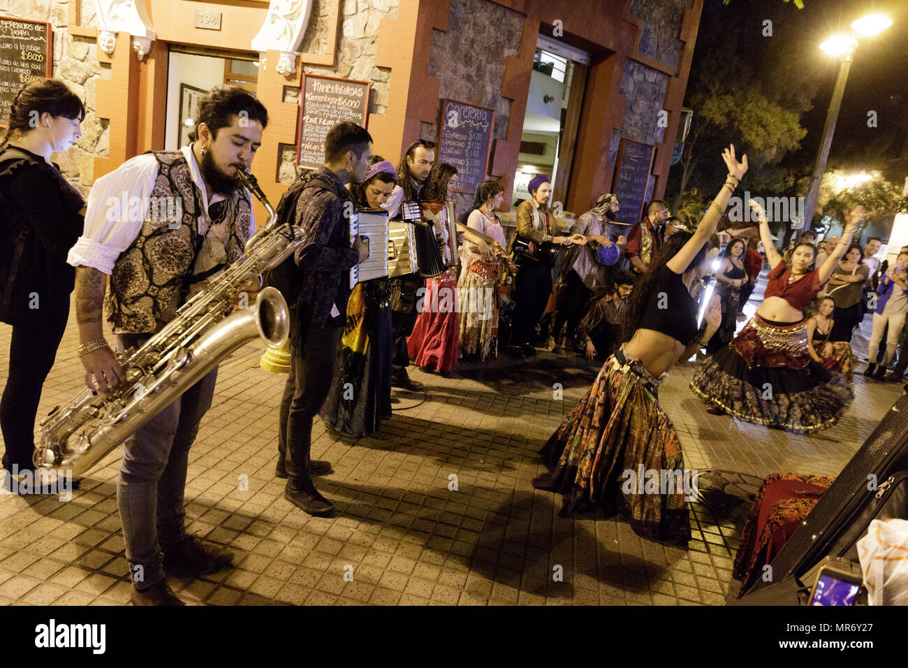 Lastarria, Santiago, Chile: A street band plays and dances to gypsy music. Stock Photo