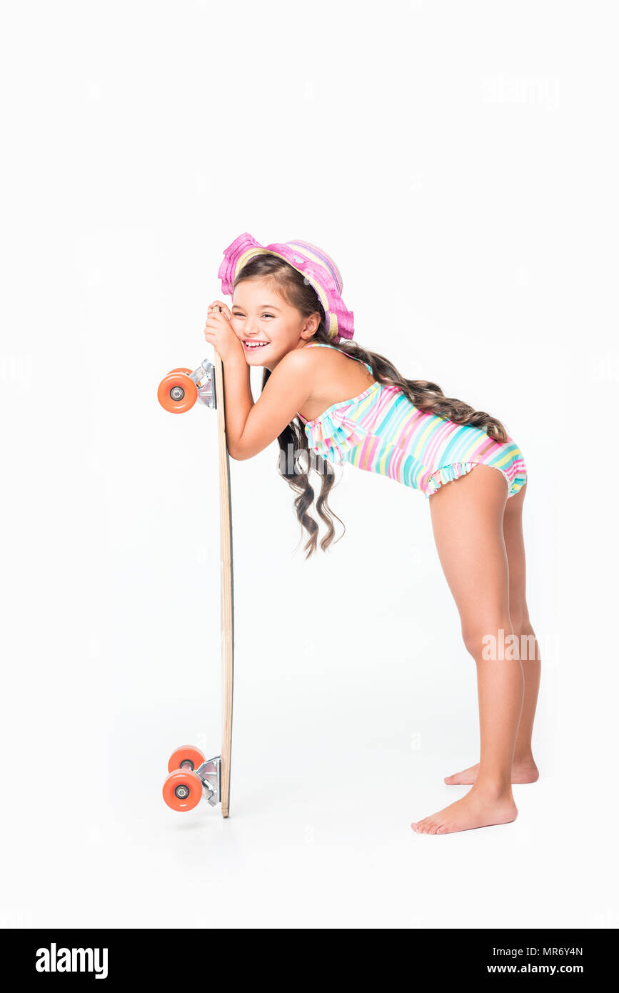 adorable little girl in swimsuit leaning at skateboard isolated on white Stock Photo Alamy