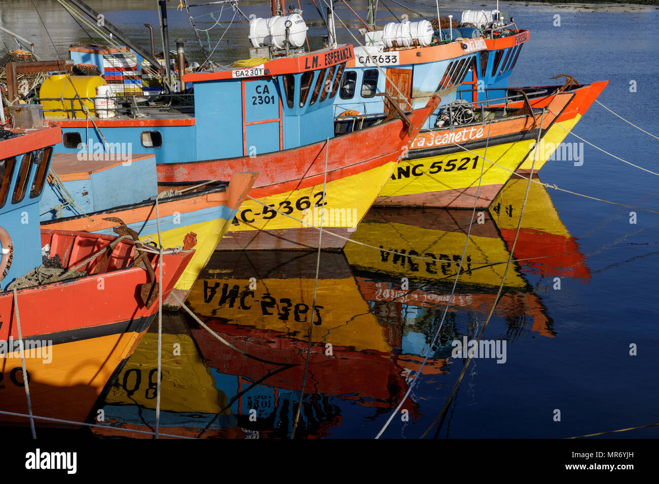 Ancud, Chiloé, Chile: Colorful fishing boats populate the harbor in Ancud, Chiloé. Stock Photo