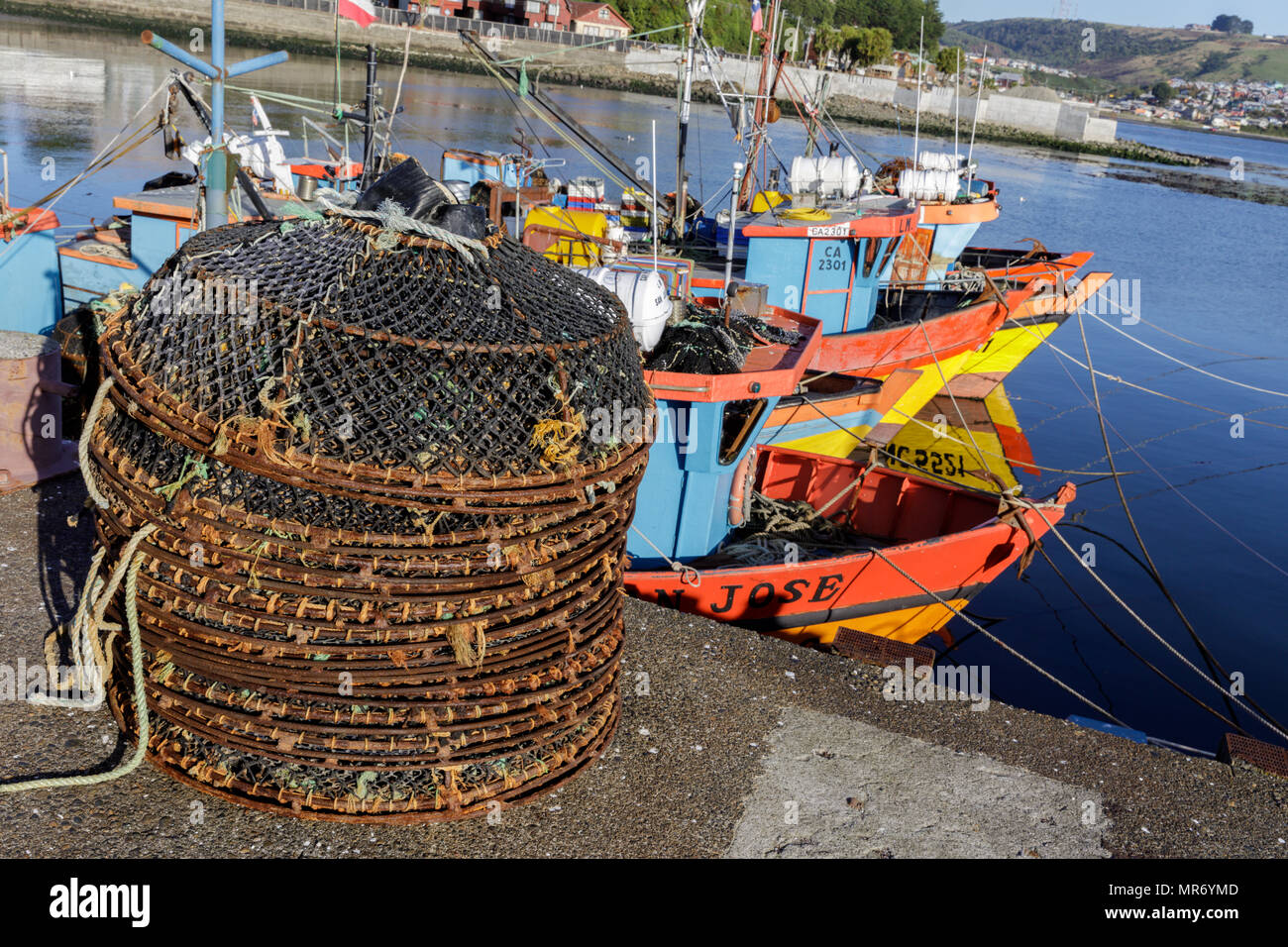Ancud, Chiloé, Chile: Colorful fishing boats populate the harbor in Ancud, Chiloé. Stock Photo