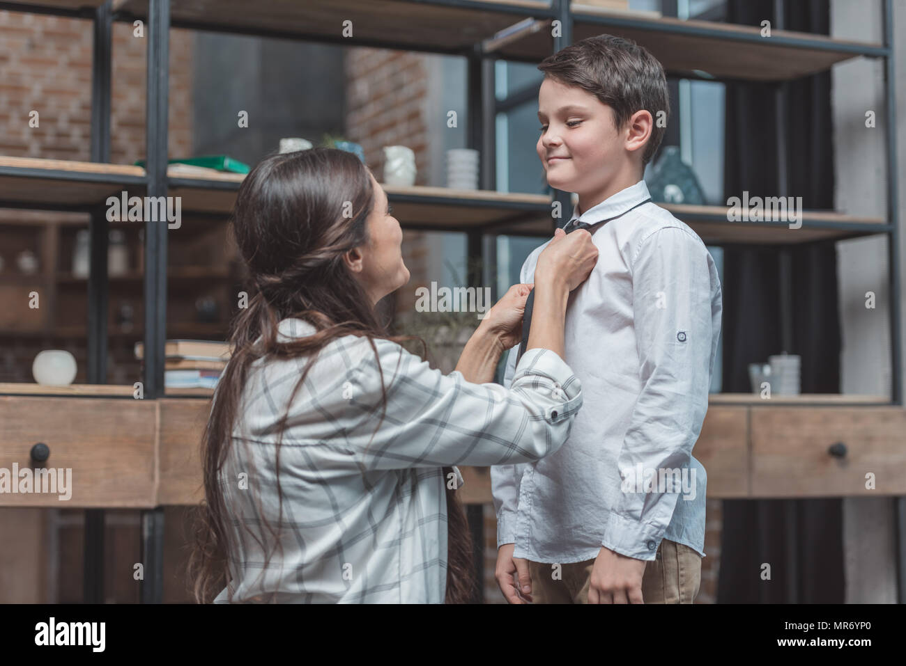 Mother Helping Son With Tie High Resolution Stock Photography and Images -  Alamy