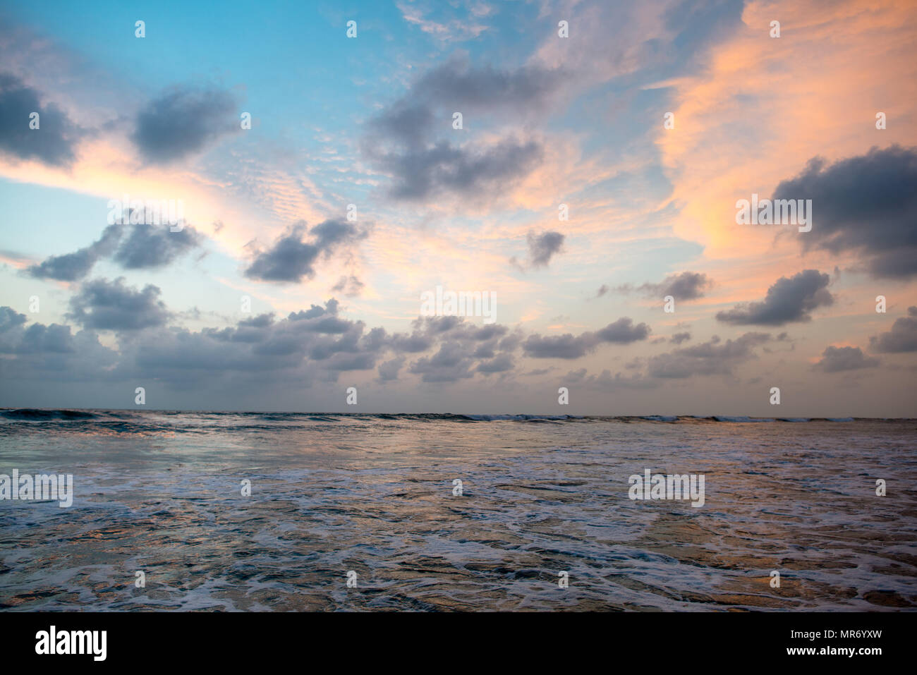 cloudy sunset sky over beautiful calm sea Stock Photo - Alamy