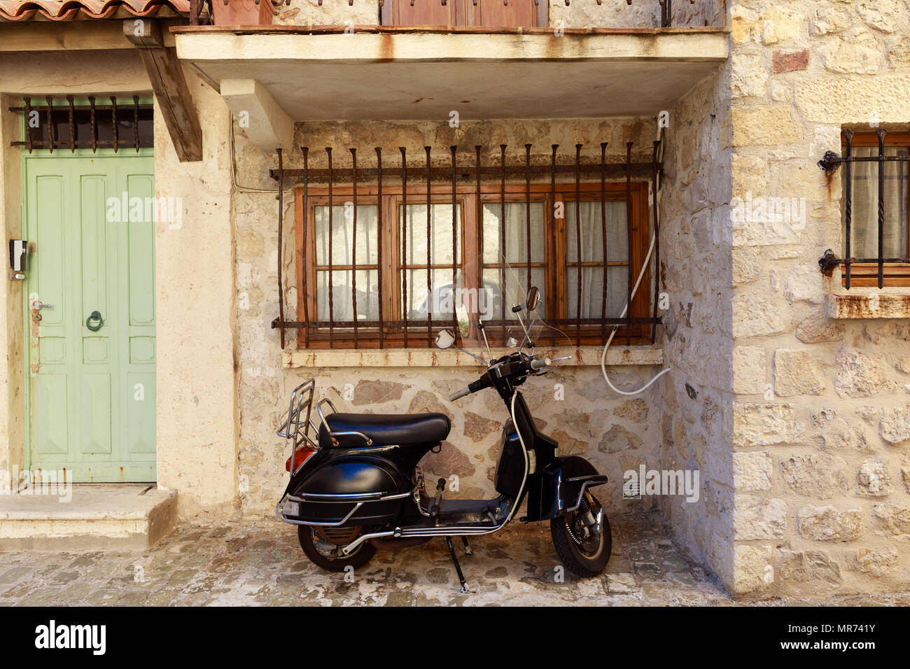 ANTIBES, FRANCE 17 SEPTEMBER 2017 scooter parked under window of