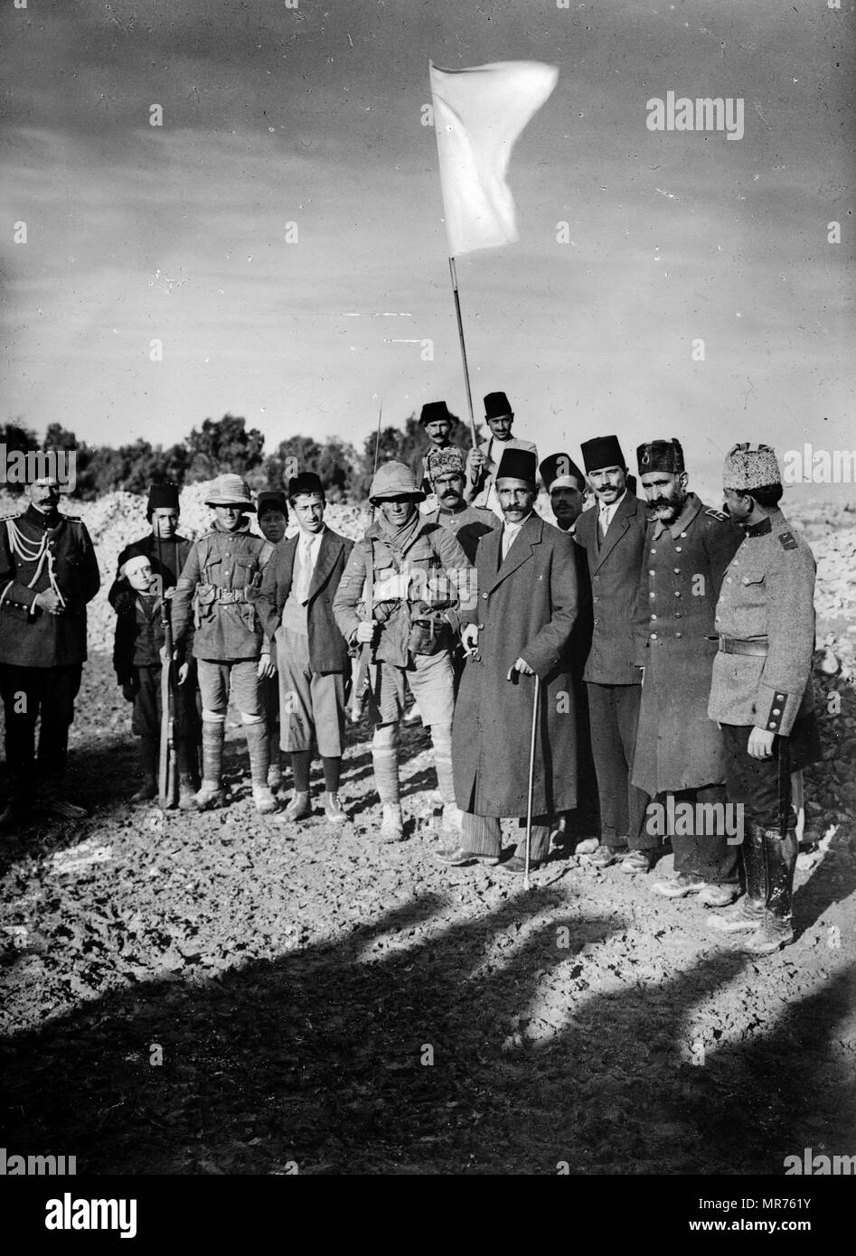 The Turkish Mayor of Jerusalem, Mayor Husseini (center, wearing a fez), is pictured here with two British infantry sergeants the morning of the surrender of Jerusalem, on Dec. 9, 1917. Left: Sgt. Sedgewick, right: Sgt. Hawcombe Stock Photo