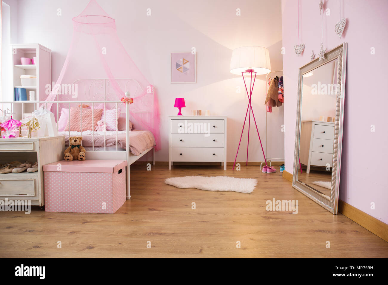 Little princess apartment with canopy bed and dresser Stock Photo - Alamy