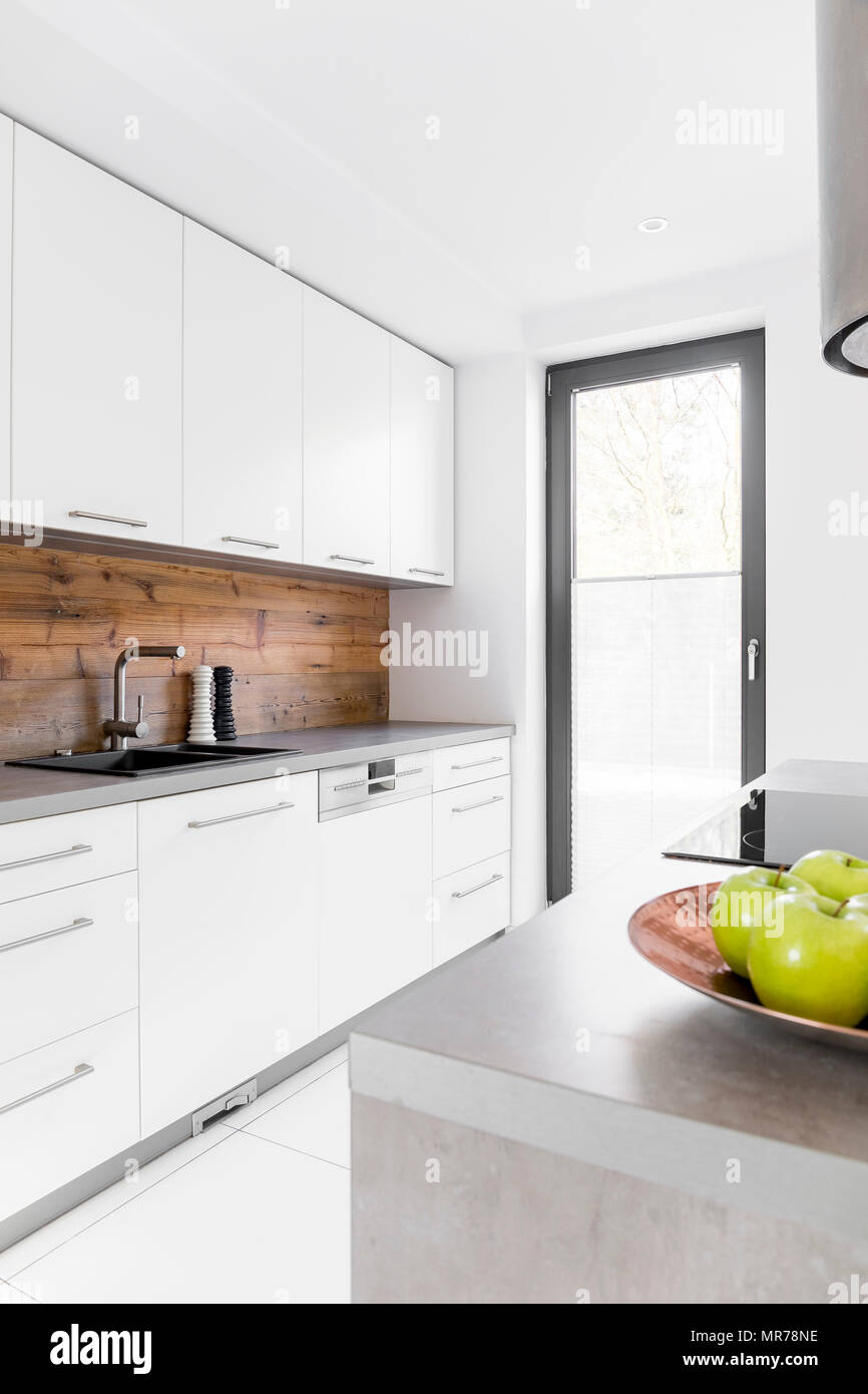 White kitchen with island in new luxury home Stock Photo