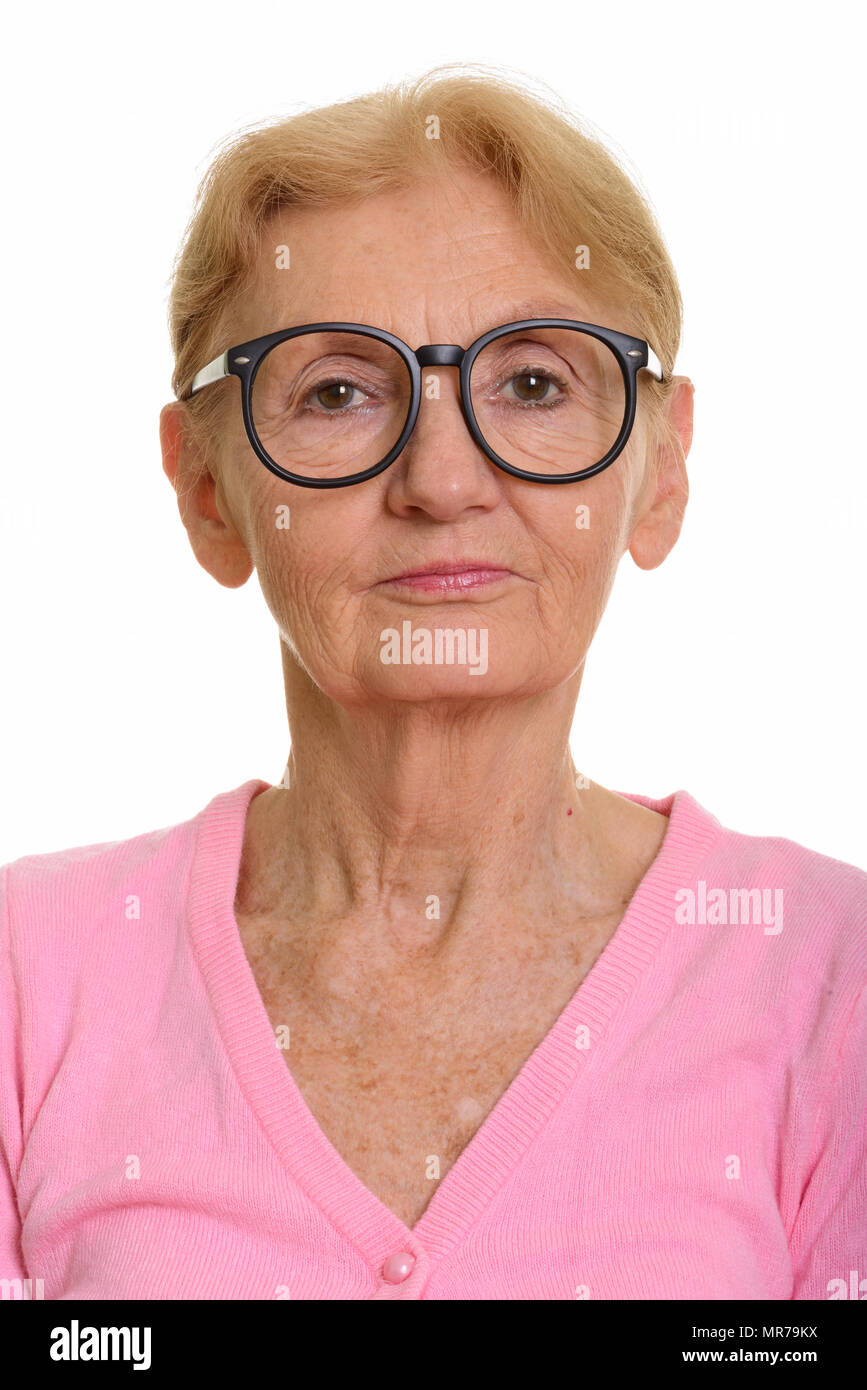 Face of senior nerd woman wearing geeky eyeglasses Stock Photo