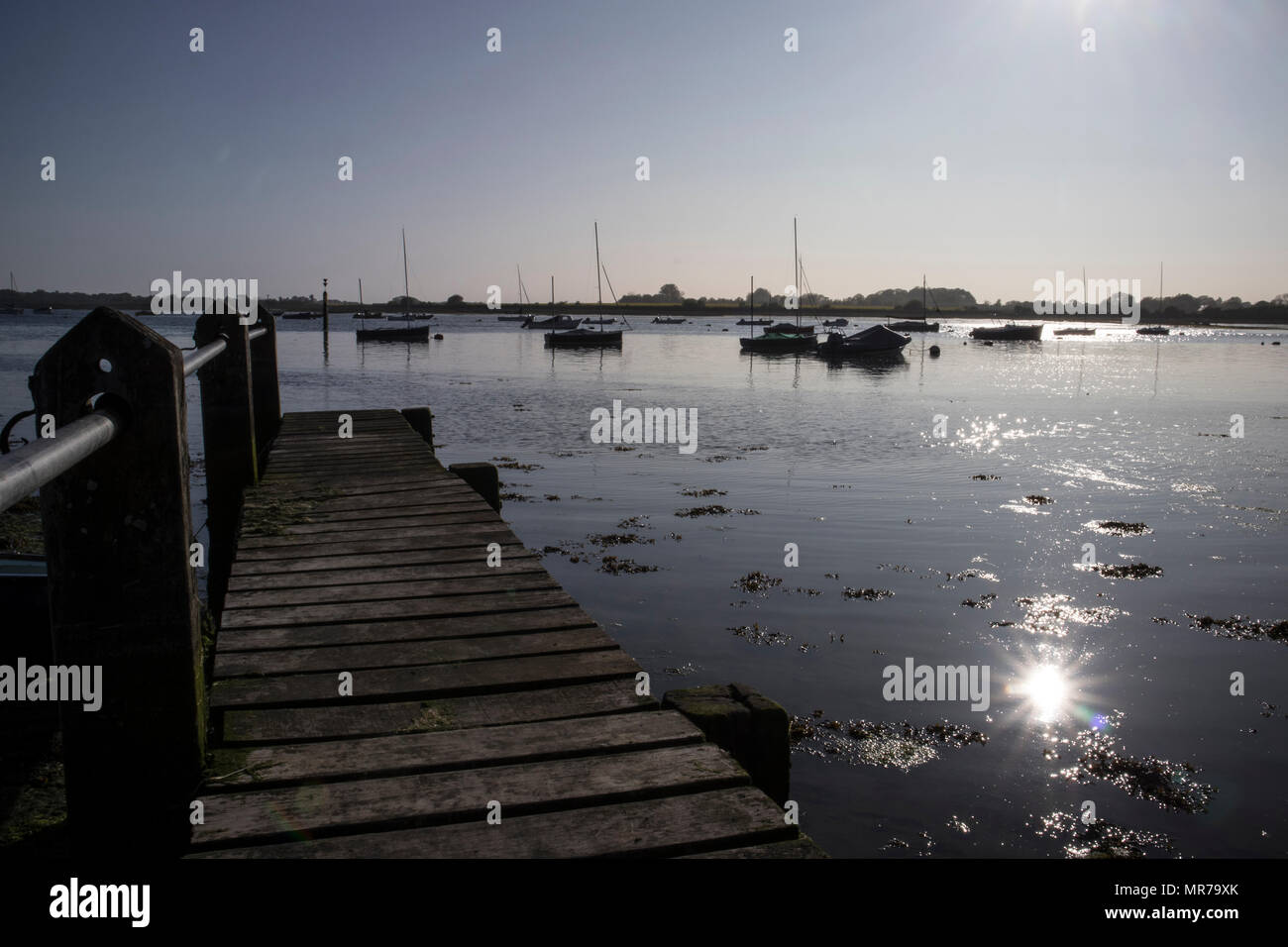 The seafront, jetty and Harbour at Bosham, Near Chichester, Sussex, UK Stock Photo