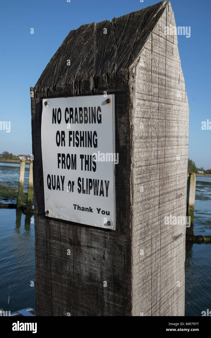 Sign - no crabbing or fishing from this slipway at Bosham, Near Chichester, Sussex, UK Stock Photo