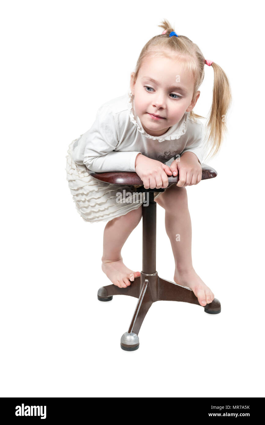 Sitting on play stool hi-res stock photography and images - Alamy