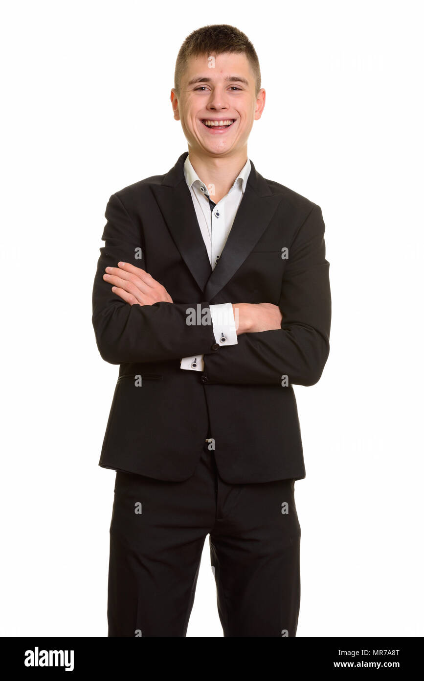 Studio shot of young happy businessman smiling with arms crossed Stock ...