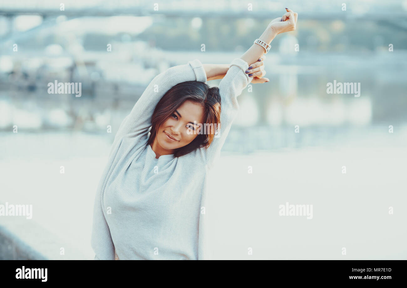 Young asian woman morning city portrait. Bright white colors. Stock Photo