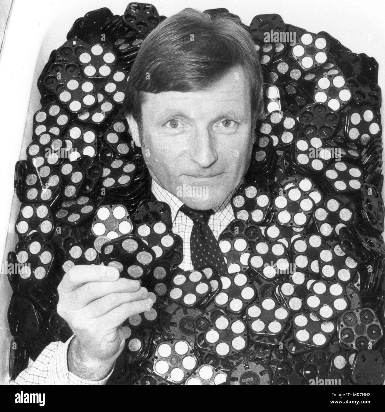 MORLEY HALL WHO INVENTED THE POUND COIN DISPENSER POSES IN THE BATH AFTER THE FIRST DELIVERY OF
