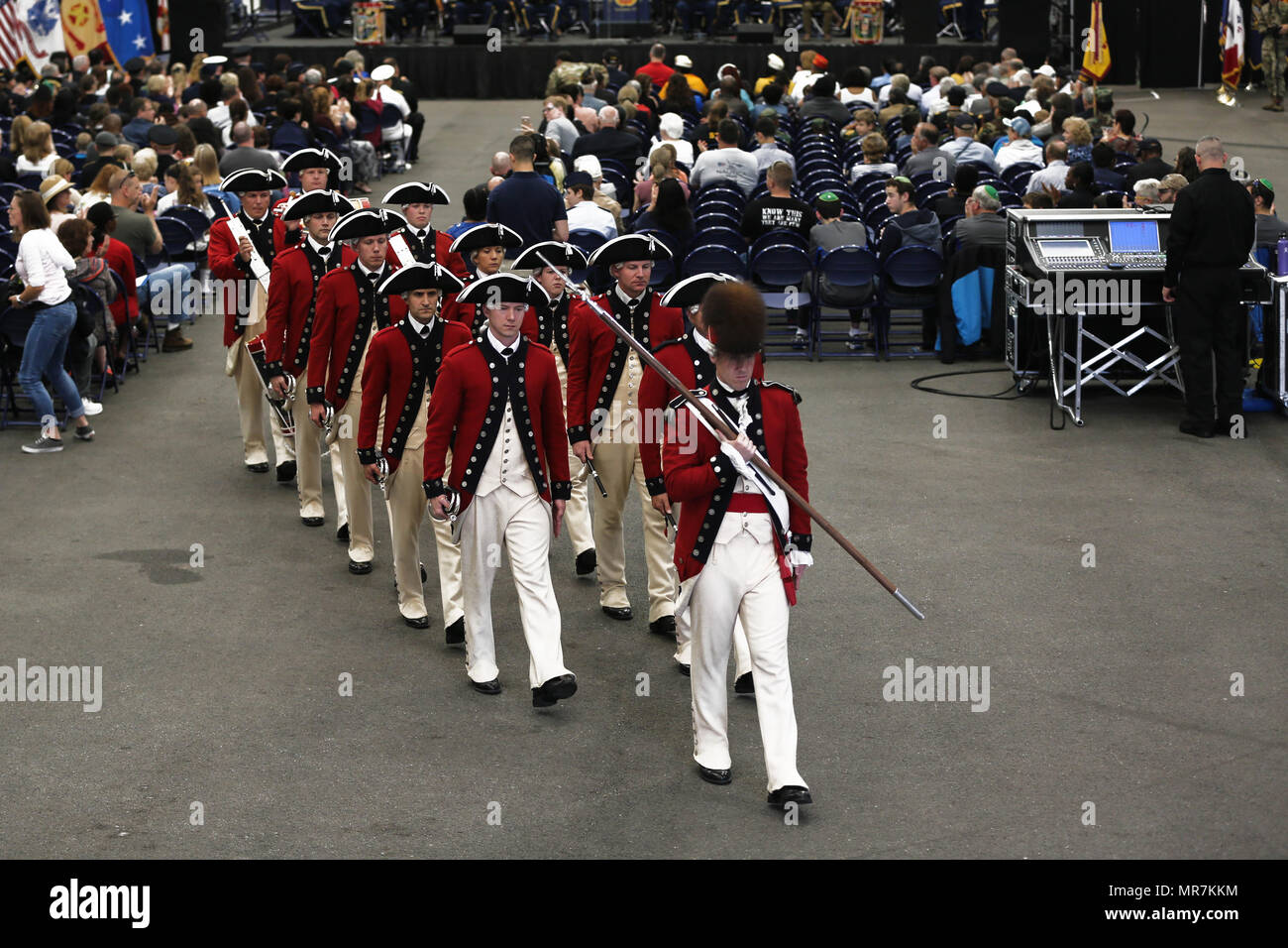 The U.S. Army Old Guard Fife and Drums Corps march down the aisle after ...